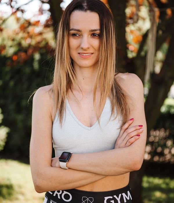 Portrait of a smiling, confident woman who practices yoga regularly.